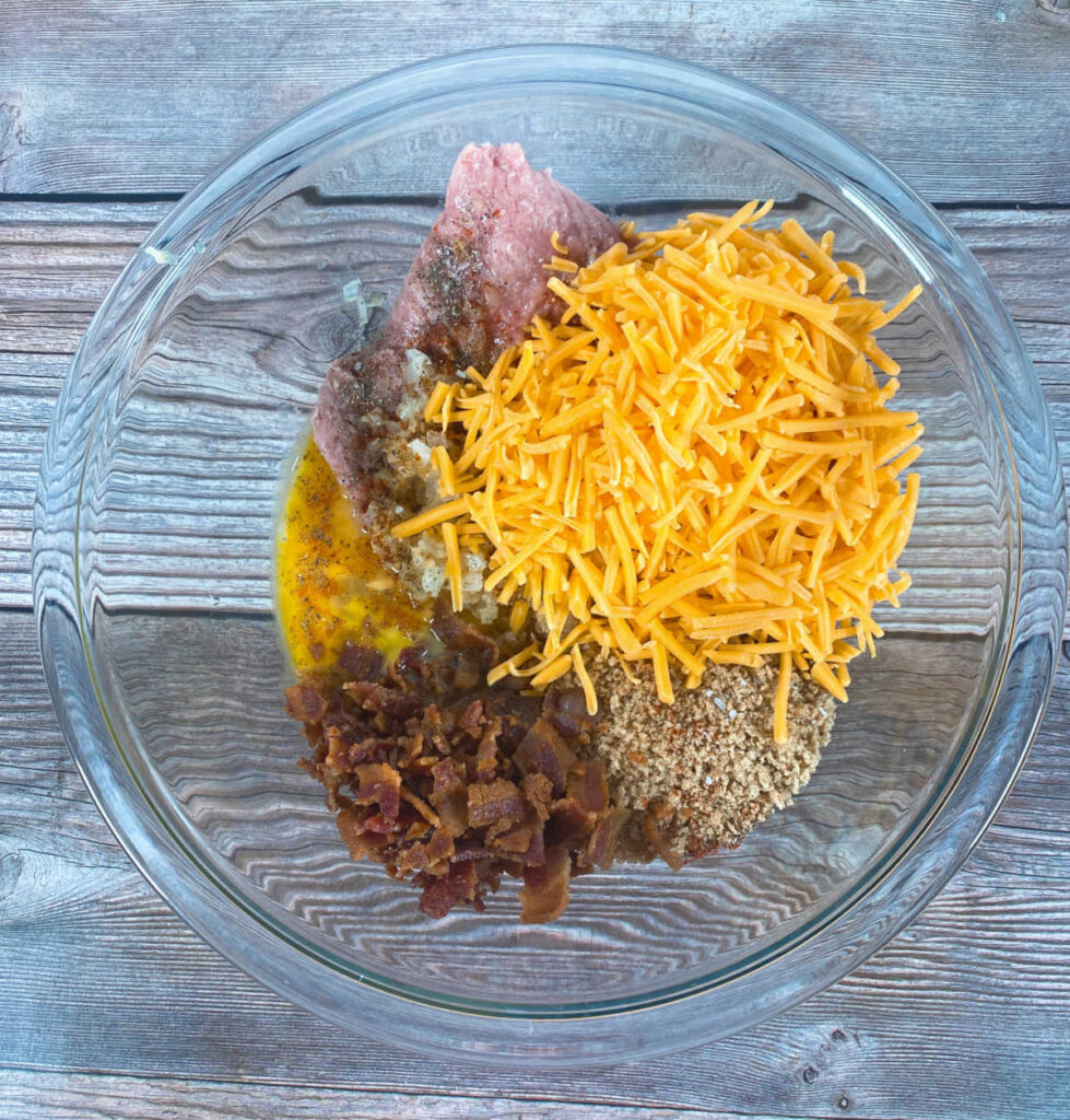 Process shot - ingredients for the meatloaf are in a glass bowl waiting to be mixed up. 