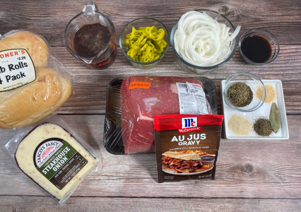 Ingredients for this recipe sit in glass bowls on a wooden background. 