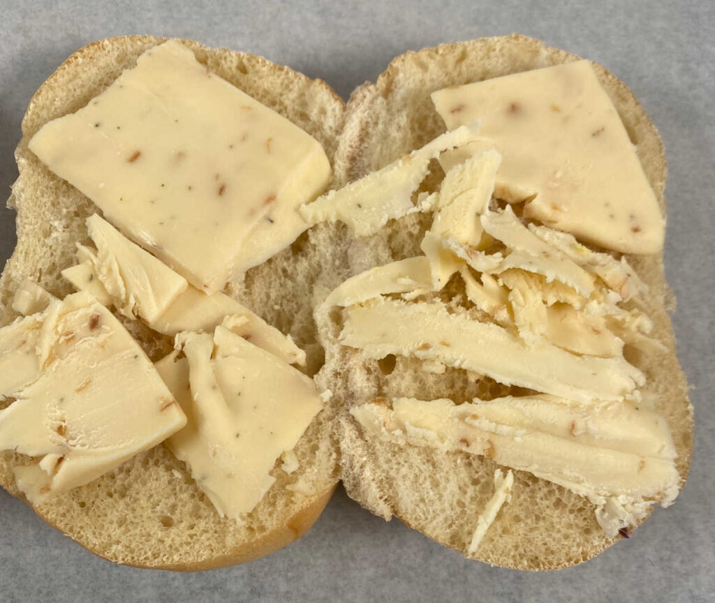 Process shot - cheese on rolls waiting to be toasted. 