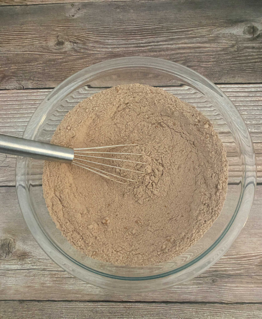 process shot - dry ingredients are mixed together in a glass bowl. 