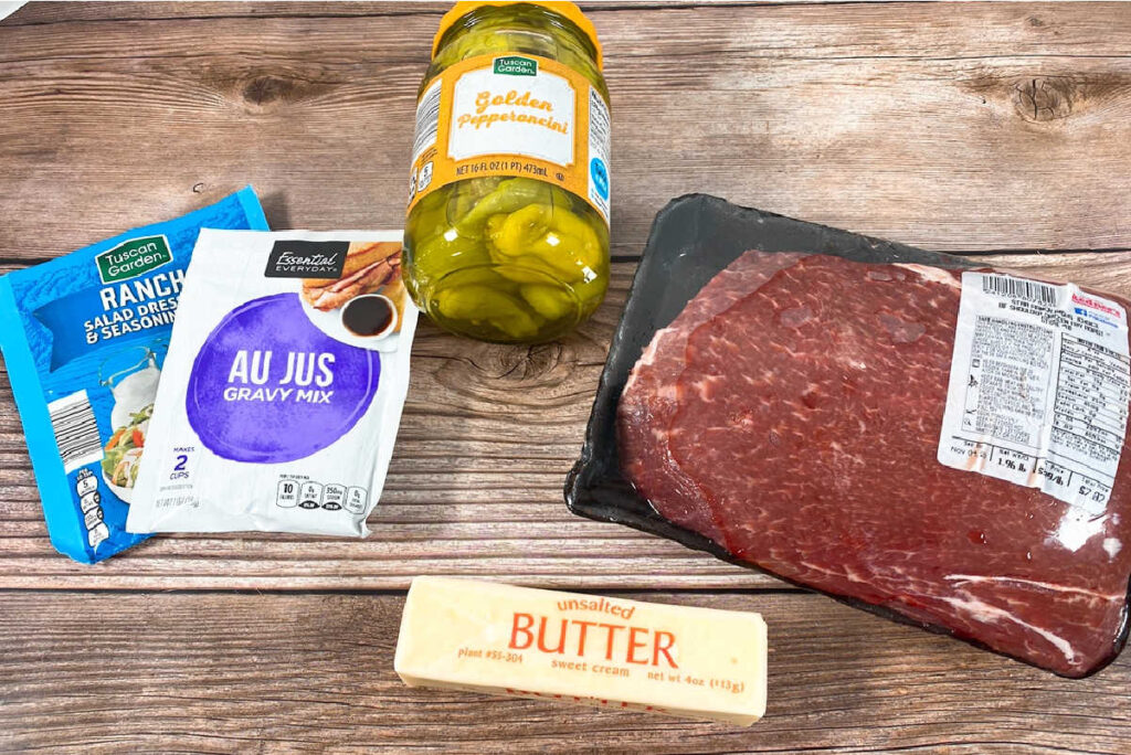 Ingredients for the recipe sit on a wooden background. 