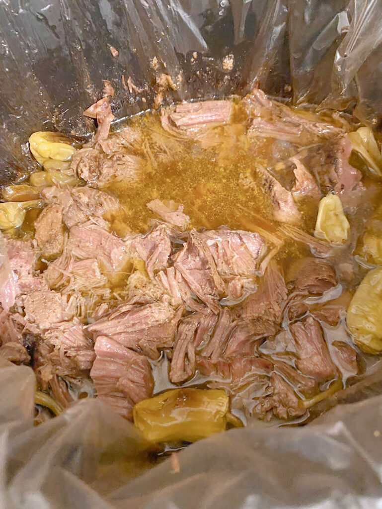 Process shot - shredded meat in the slow cooker. 
