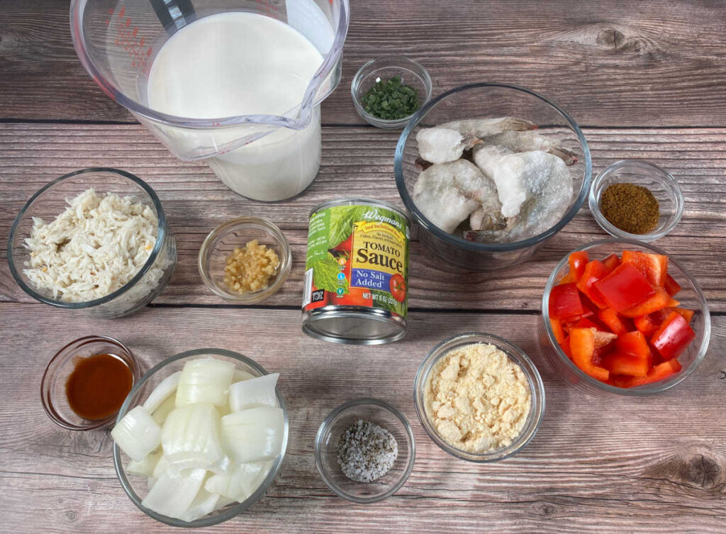 ingredients for the recipe sit on a wooden background. 