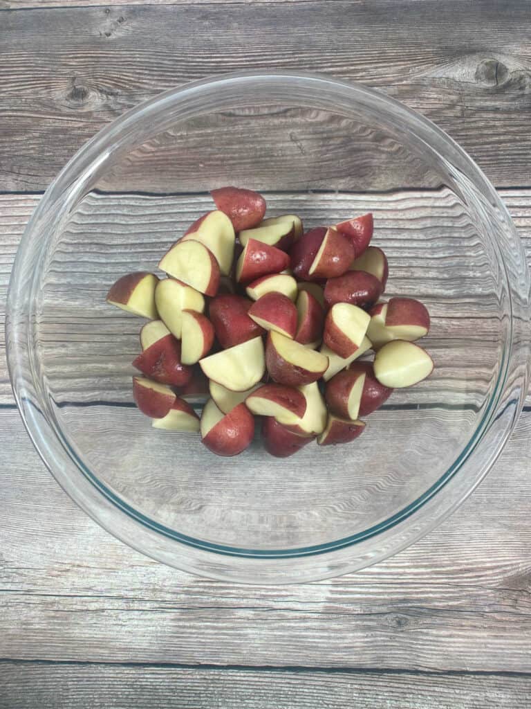 Process shot - potatoes in a bowl. 