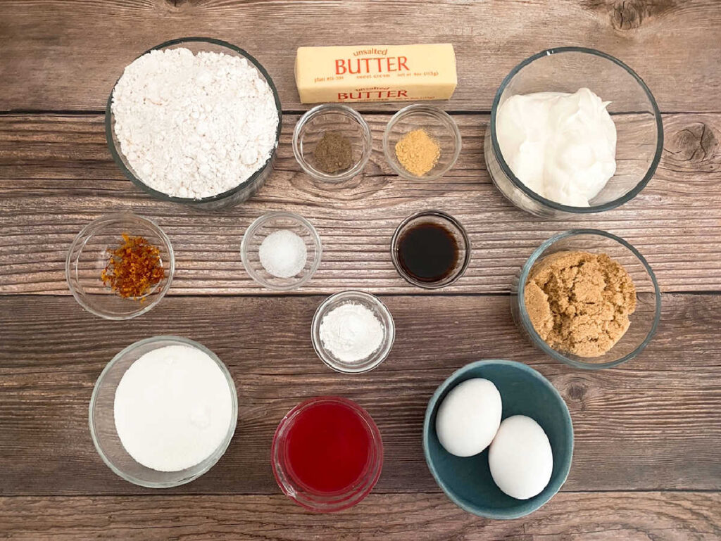 Ingredients for the recipe, portioned out in glass bowls, sitting on a wooden background. 