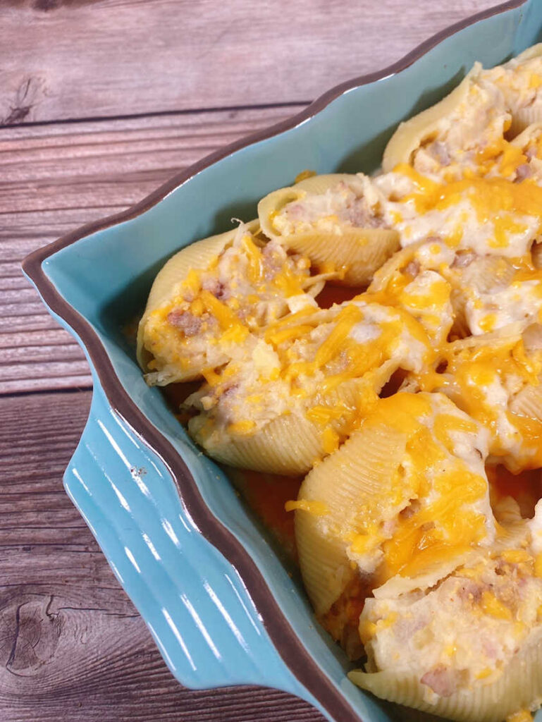 Close up, angled image of baked stuffed shells. 