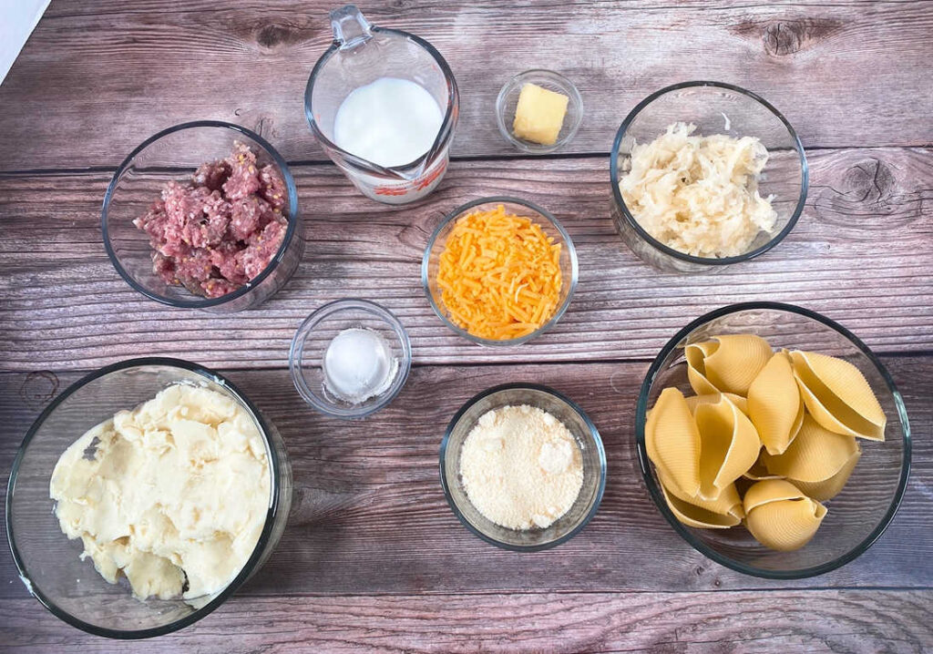 Ingredients for the recipe are portioned out and sitting in glass bowls on a wooden background. 