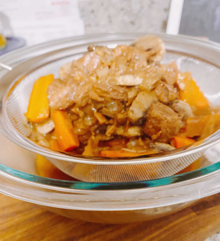 Process shot - strained ingredients in a glass bowl. 