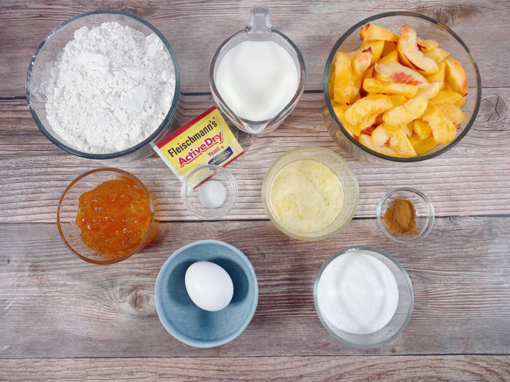 Ingredients for the recipe sit on a wooden background. 