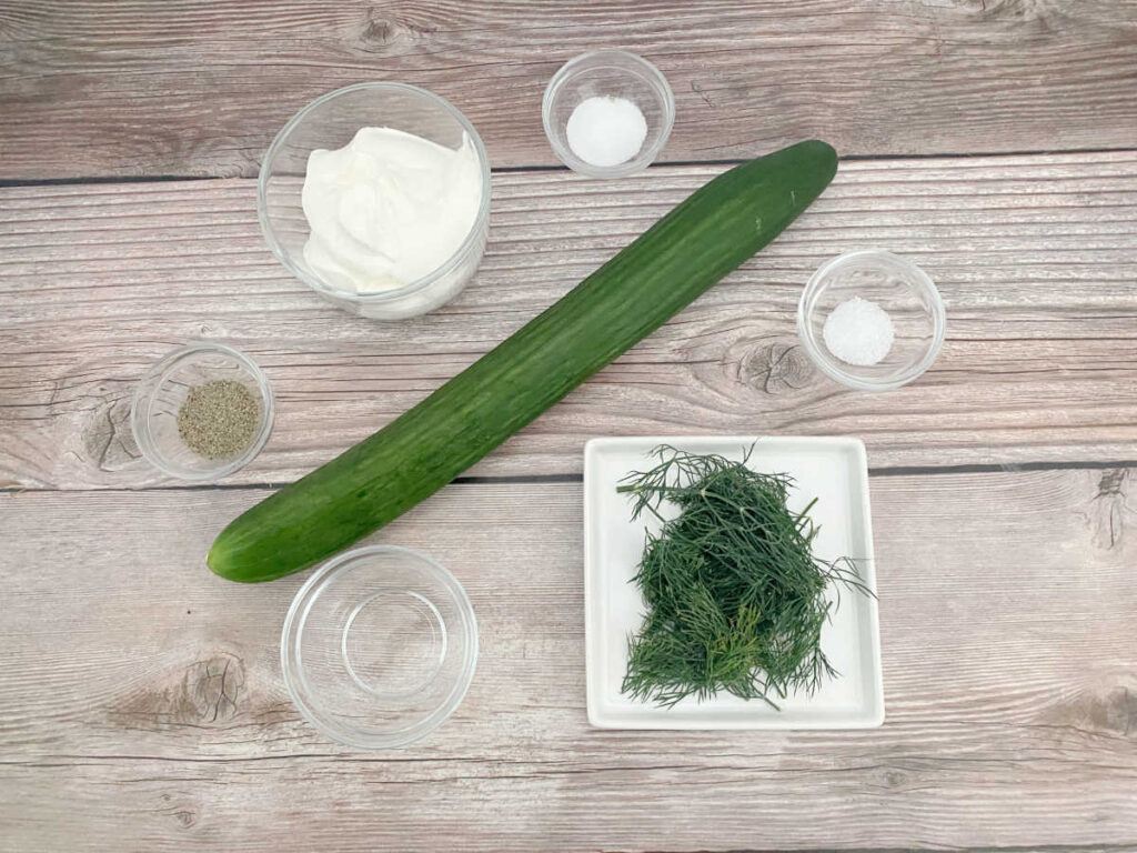 Ingredients sit on a wooden background. 