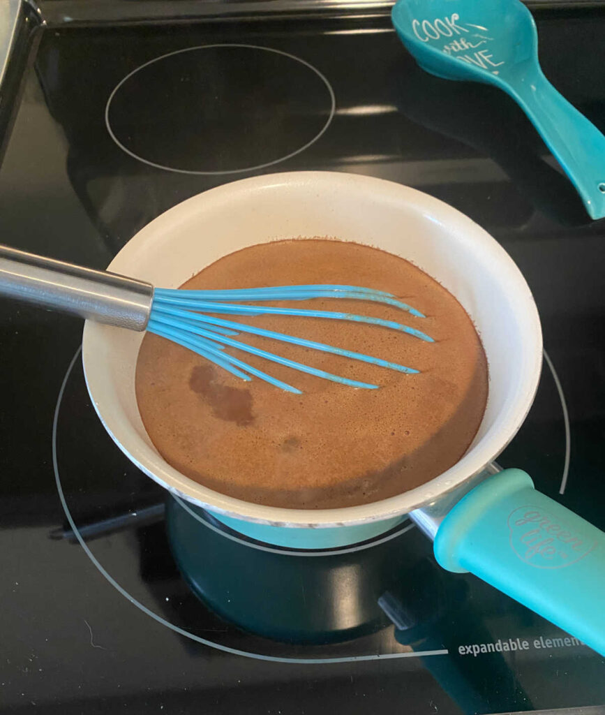 Process shot - wet ingredients in a saucepan on the stove. 