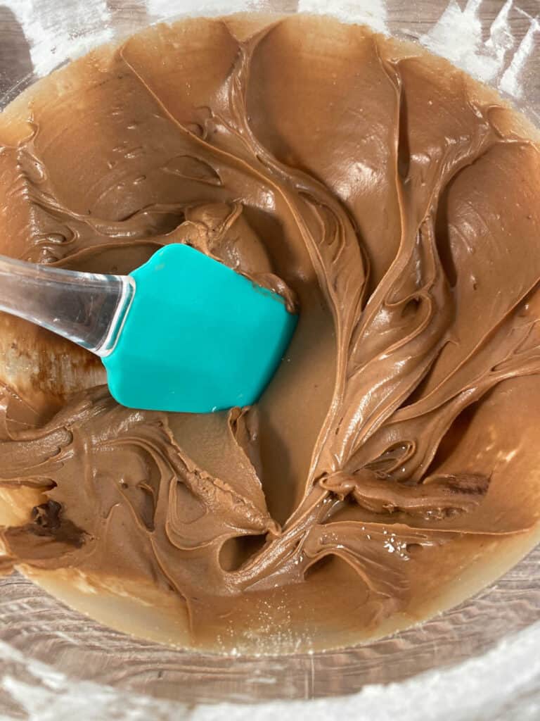 Process shot - frosting in the bowl of a stand mixer. 