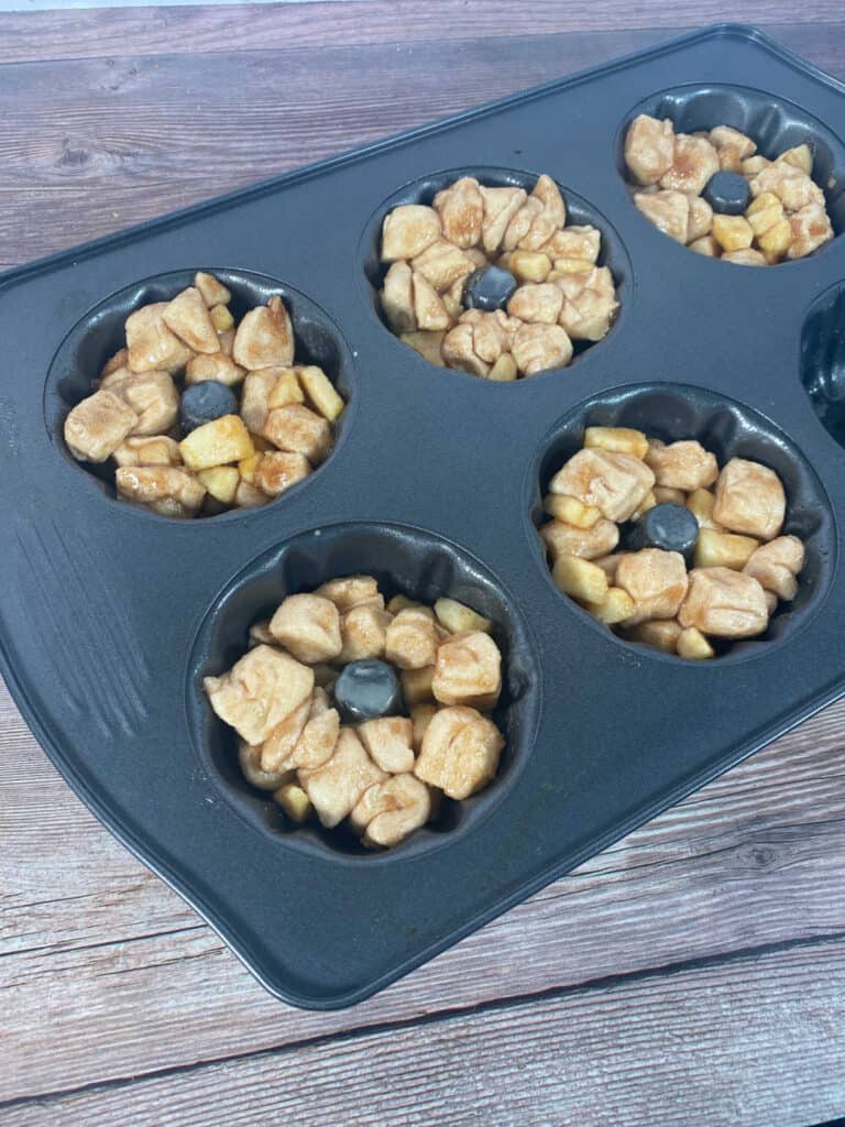 Process shot - monkeybread filled in the mini bundt pan. 