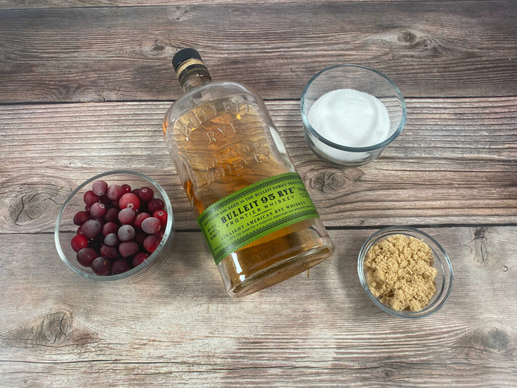 ingredients for the recipe sit in glass bowls on a wooden background. 