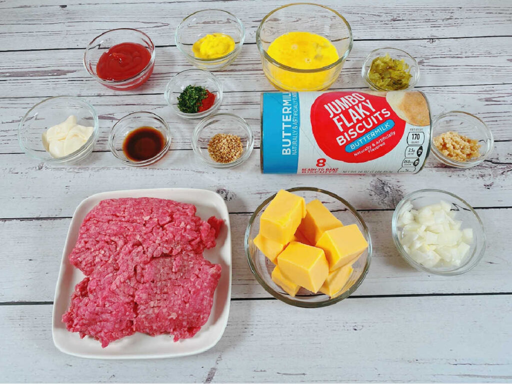 ingredients for the recipe sit in glass bowls on a wooden background. 