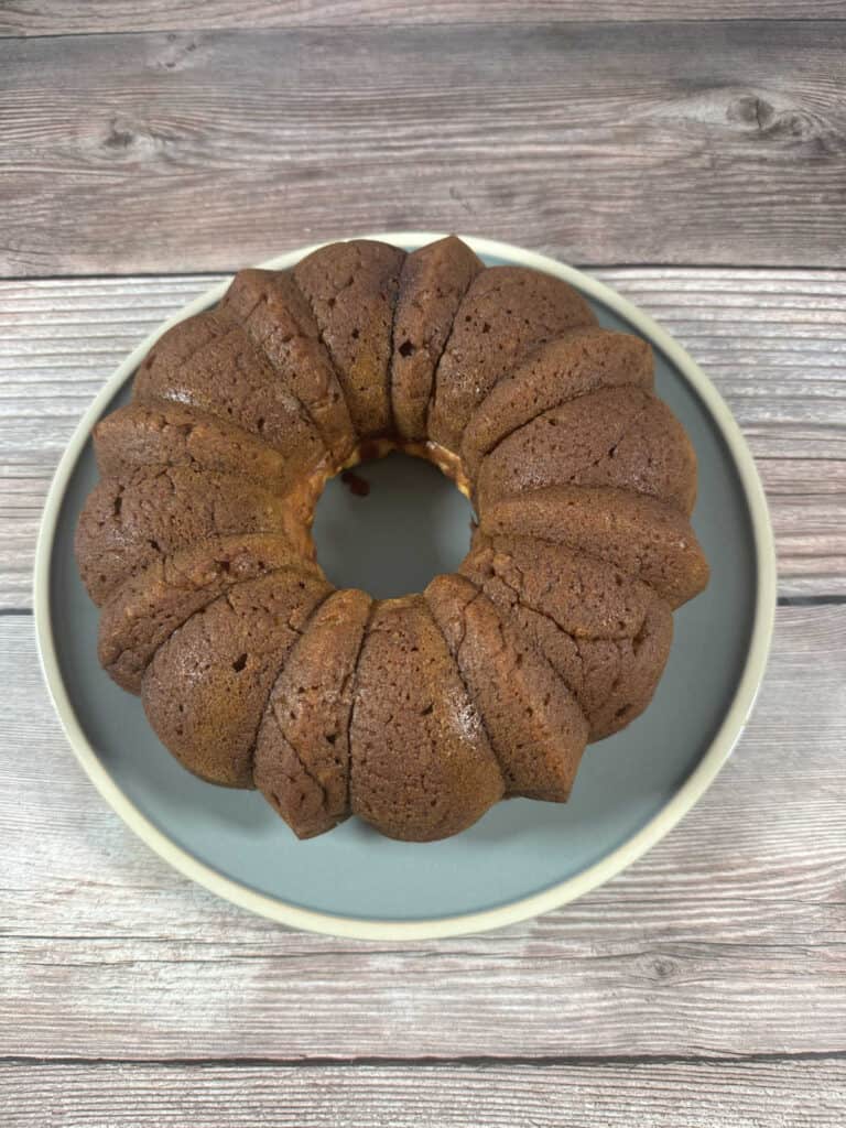 Overhead image of cake on a blue round plate. 