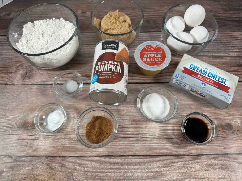 ingredients for recipe sit on a wooden background. 