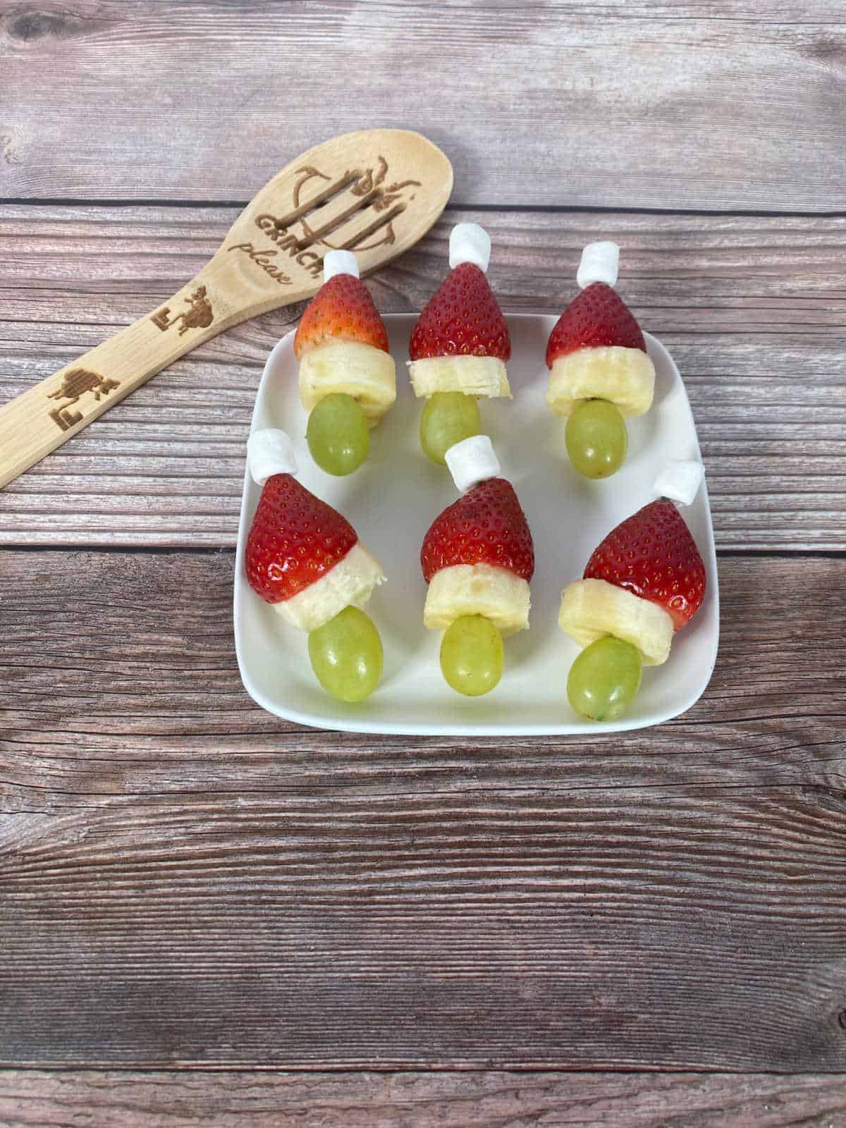 skewers sit on a white plate