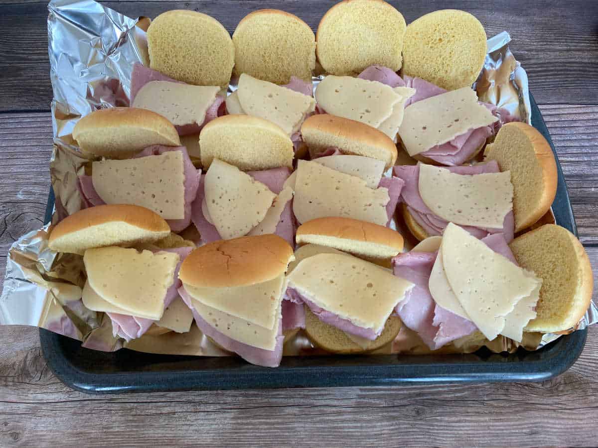 Process shot - sliders with ham and cheese. 