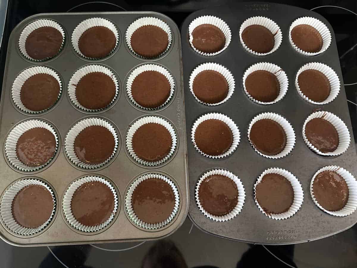 Process shot - cupcake batter in baking tins. 