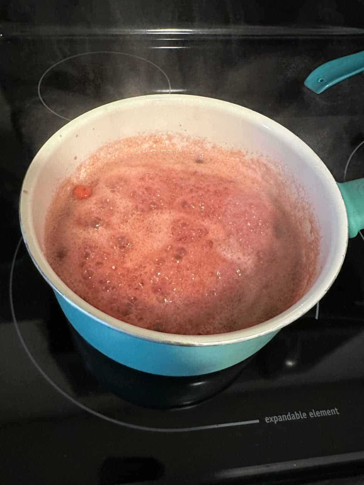 Process shot - ingrediens boiling in a saucepan. 