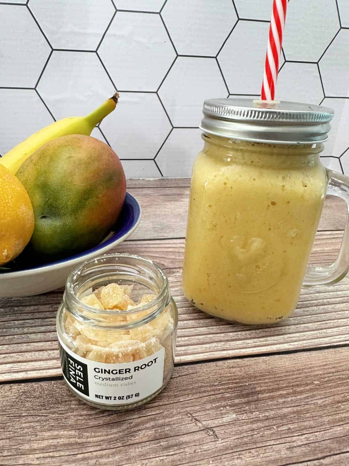 Smoothie in a mason jar on a wooden background. 