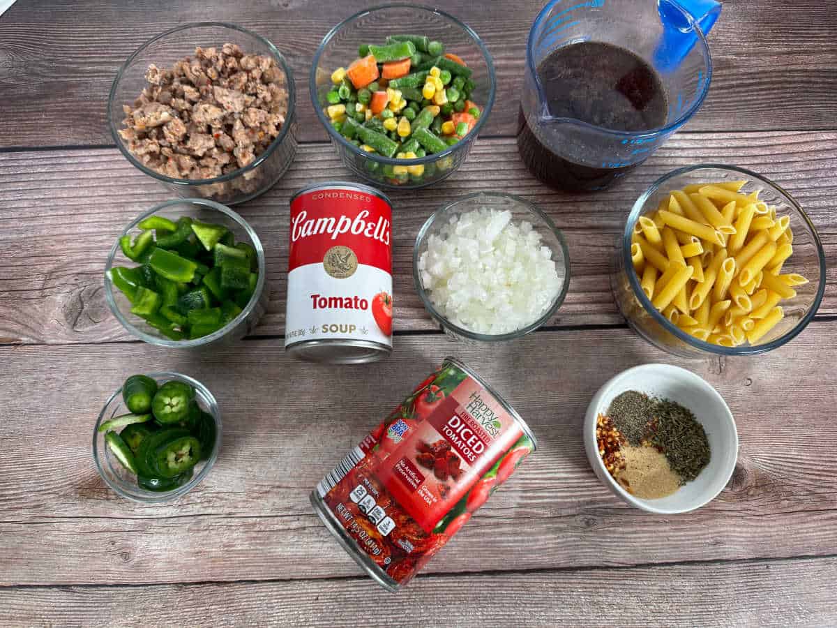 Ingredients for the recipe sit on a wooden background. 