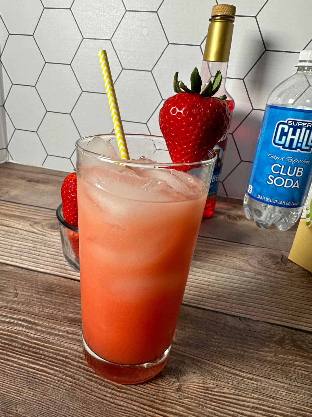 Complete drink, sitting on a wooden background. 