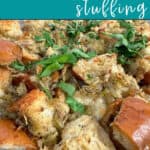 Image for Pinterest with text overlay. Close up image of baked stuffing topped with fresh parsley.