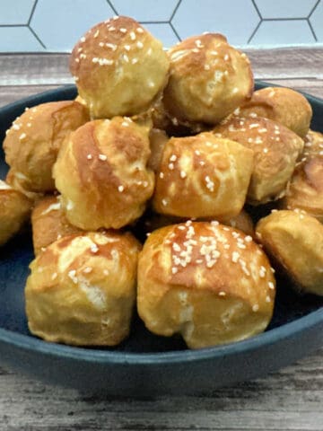 Close up image of plate of pretzel bites stacked high.