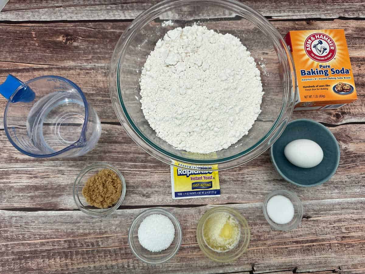 Ingredients for the recipe in glass bowls on a wooden background.