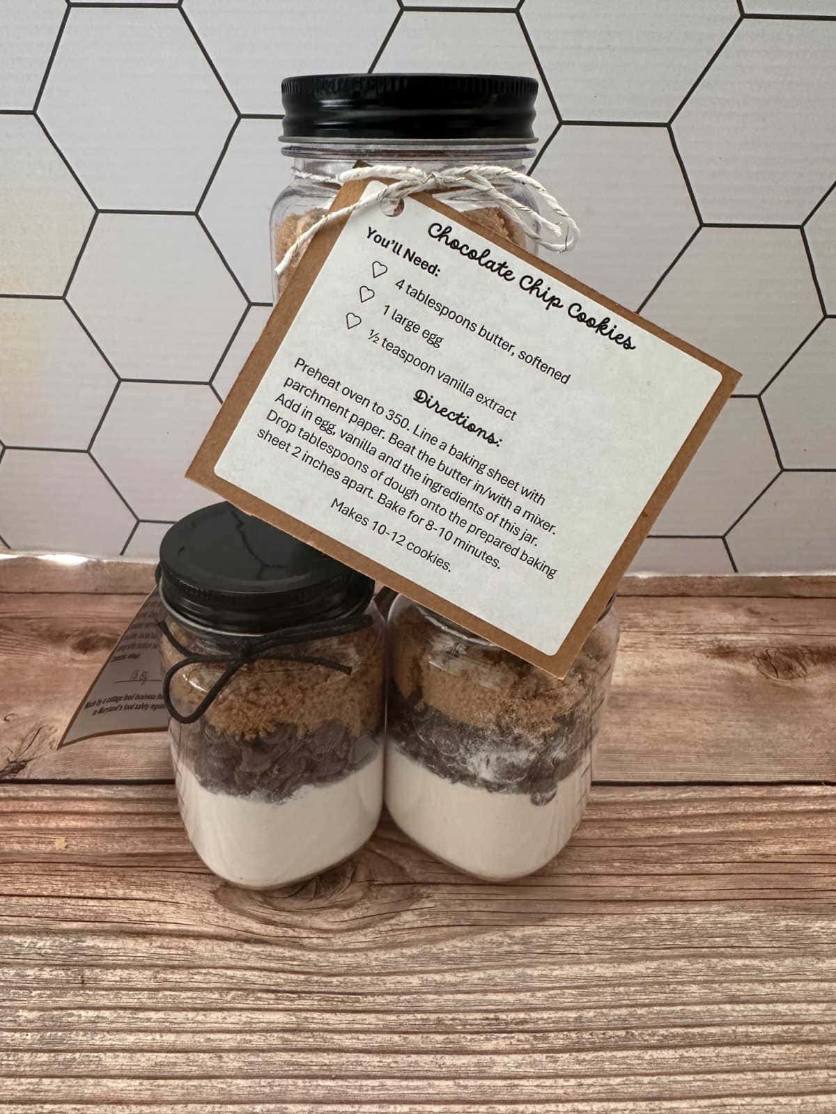 Stack of cookie mix jars, with label and instructions facing outward. 